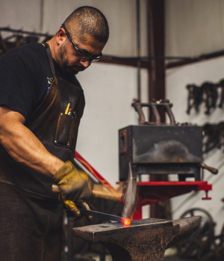 A blacksmith forging metal