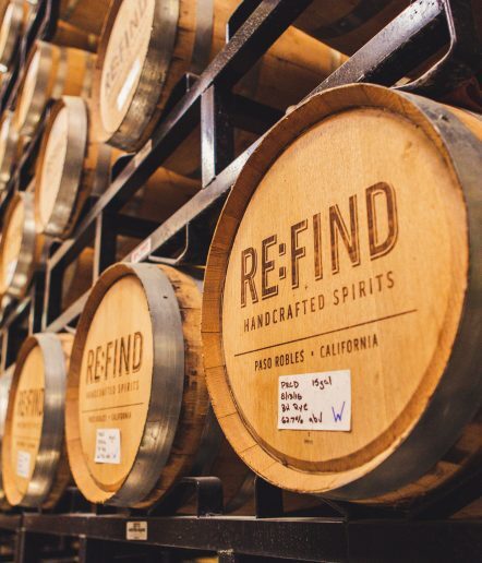 Wooden barrels of liquor on racks