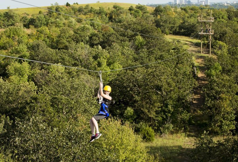 Young woman riding a Zipline Canopy Tour