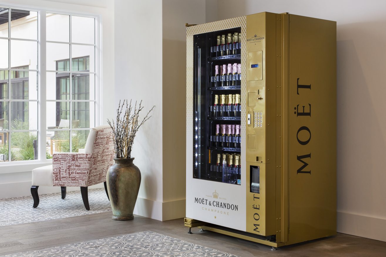 A vending machine for mini Moet champagne bottles.