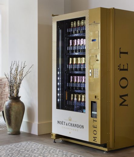 A vending machine for mini Moet champagne bottles.